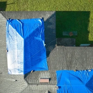 Tarp over roof after storm damage.