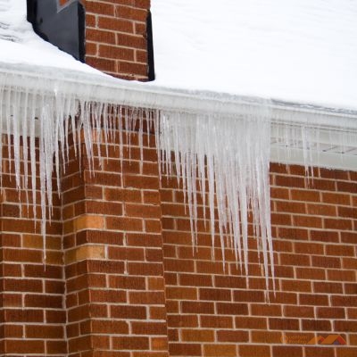 ice dams with icicles on roof's edge