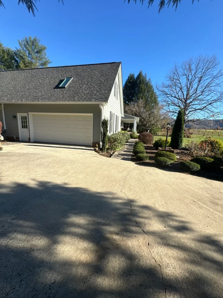 Front view of a home with a skylight visible on the roof after repair work was completed.