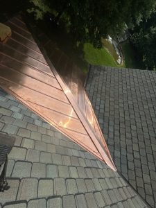 Architectural shingles with a copper accent.